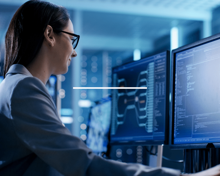 woman at computer Gains real-time visibility to container & vessel location through data feeds from 3rd-party service providers.