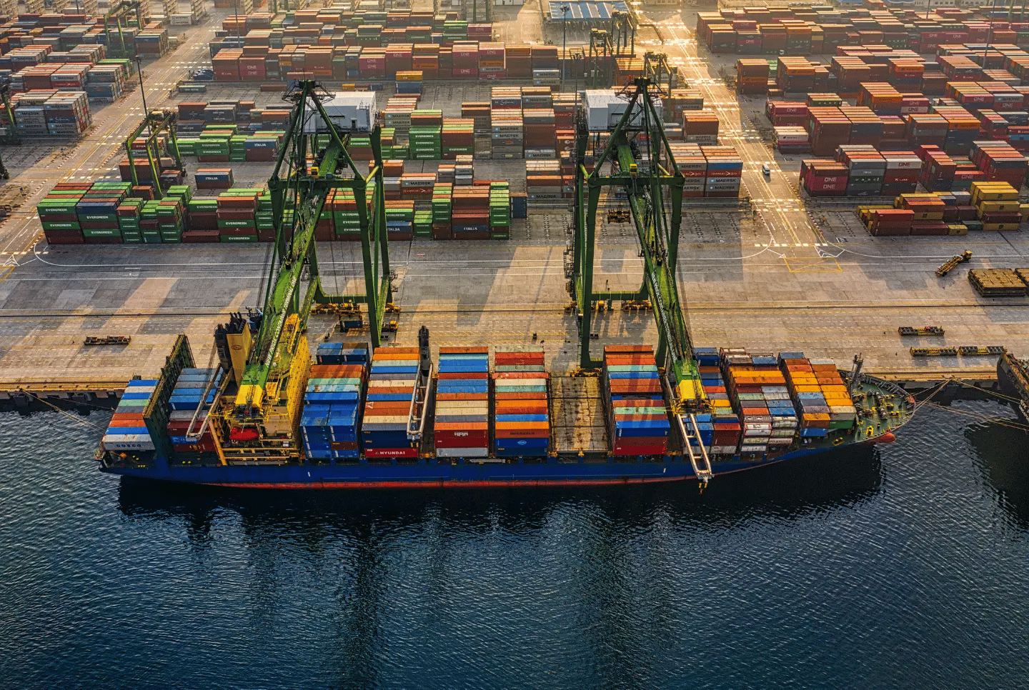 Cargo ship being loaded at port